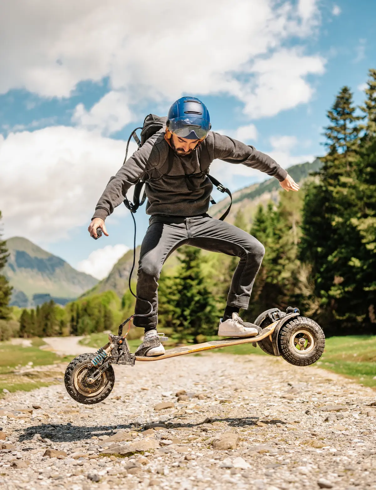 Adrien Ladan mid-jump with a Stern' on a mountain track
