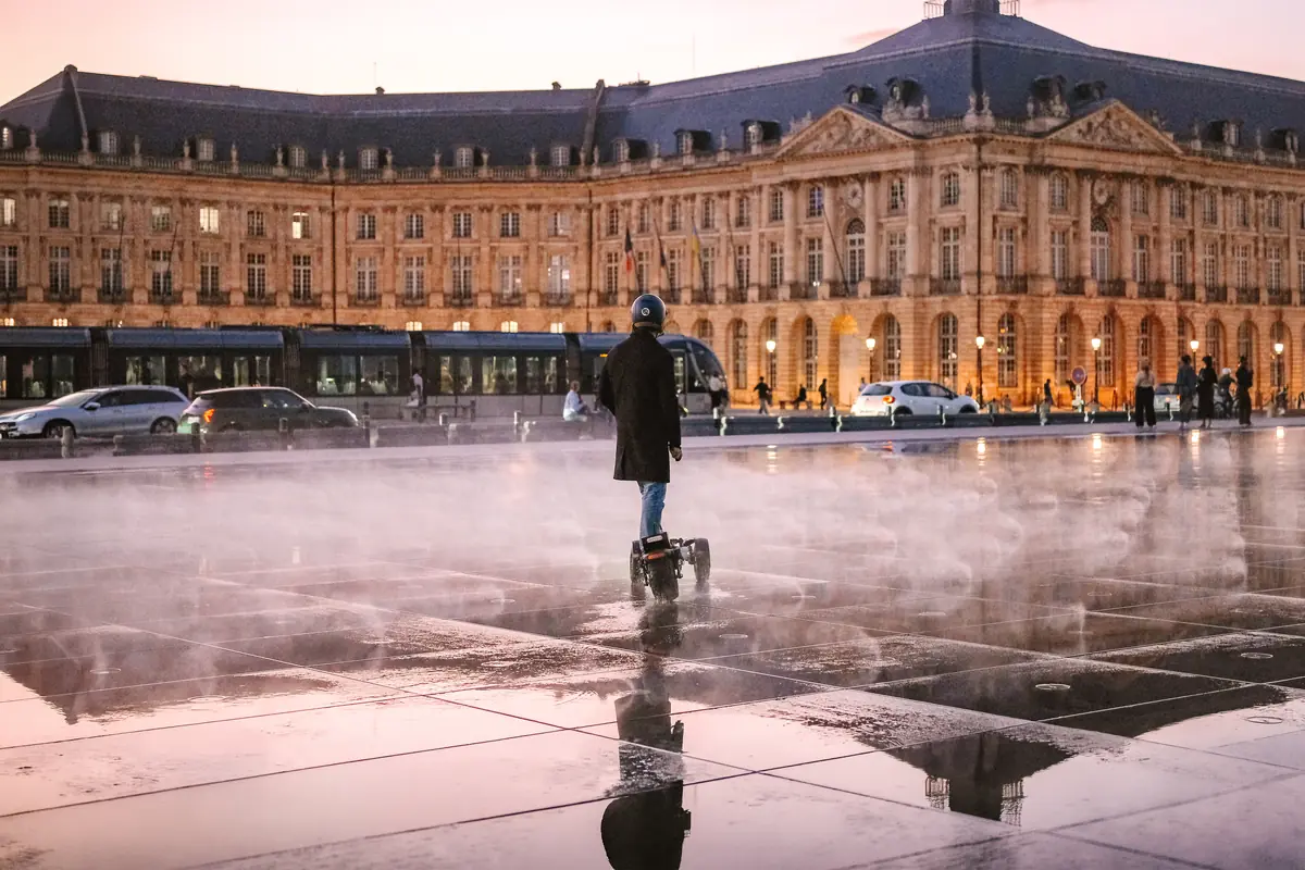 Rider in front of the place de la Bourse in Bordeaux, reflected in the water mirror