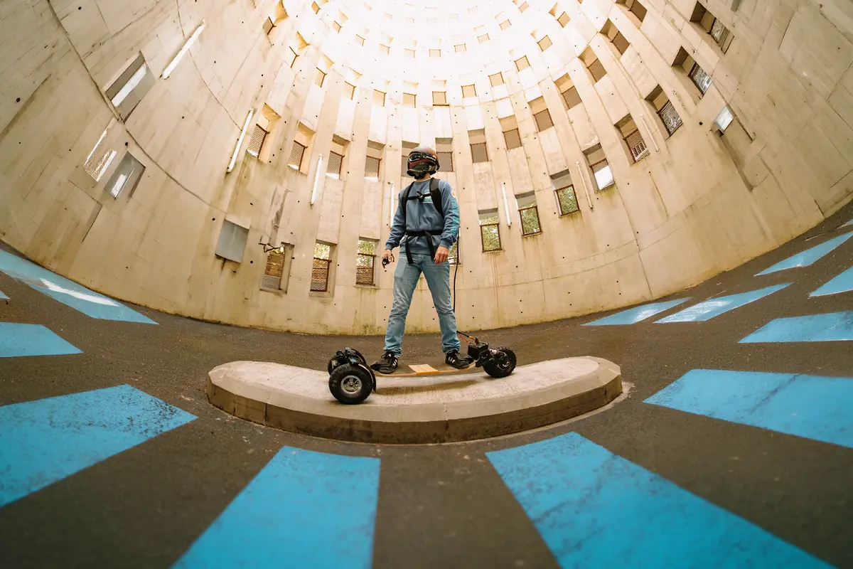 Rider on their Stern' in the centre of a circular apartment-block courtyard, wide-angle view