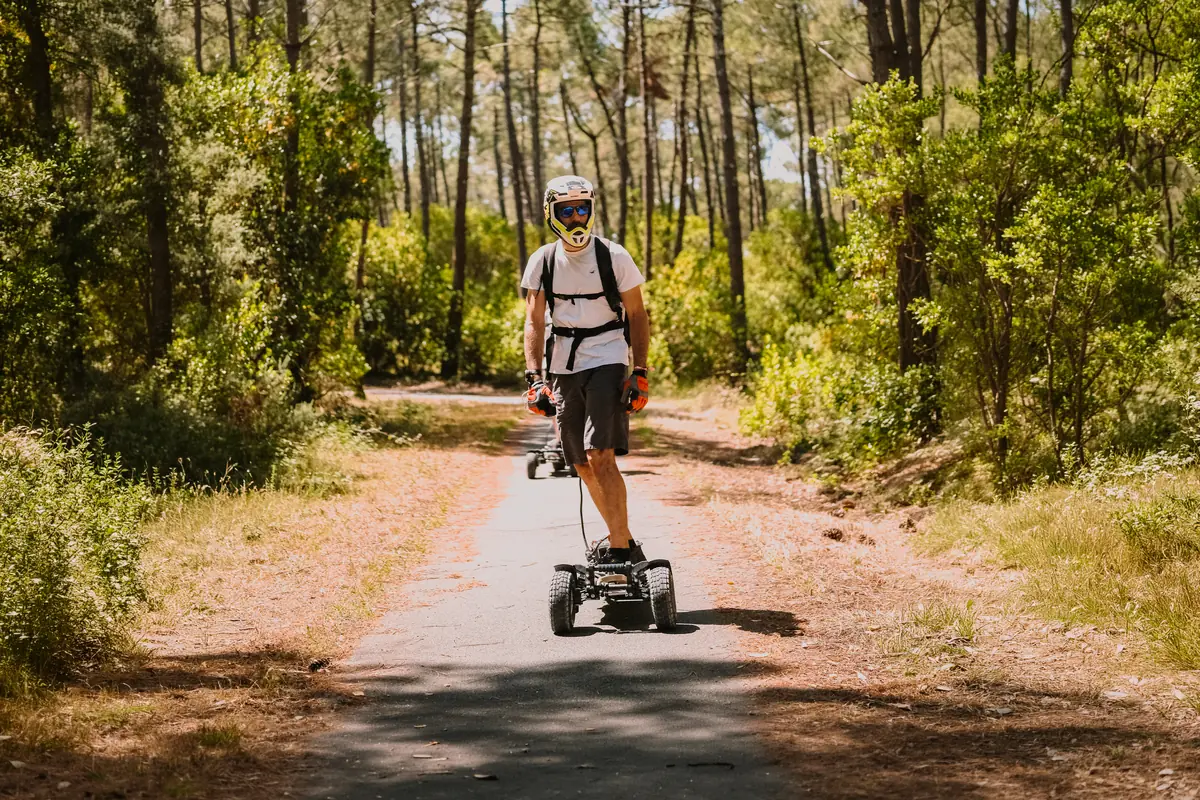 Bertrand on his Stern' on a track in a pine forest